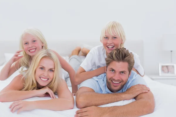 Parents giving piggy back to their children — Stock Photo, Image