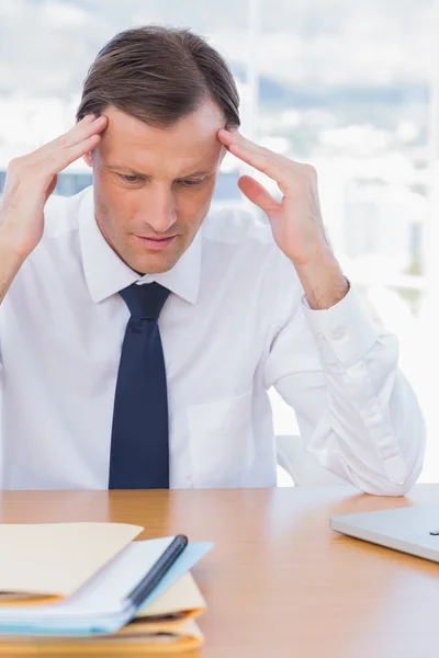 Anxious businessman holding his head Stock Image