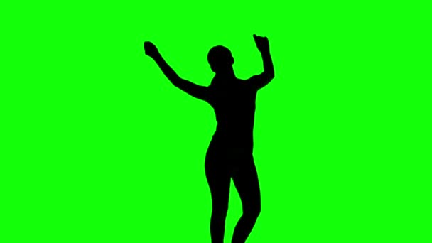 Silhouette of woman moving arms in the air on green screen — Stock Video