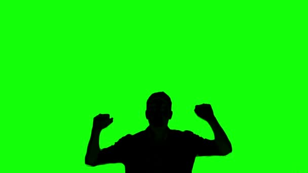 Silhouette eines springenden Mannes auf grünem Bildschirm — Stockvideo