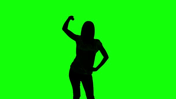 Silhouette of woman doing disco gesture on green screen — Stockvideo