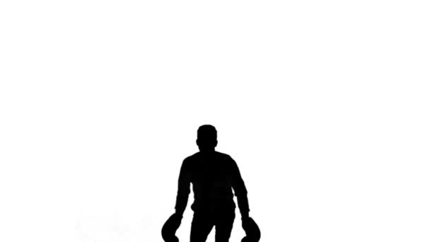 Silhueta de homem pulando e boxe no fundo branco — Vídeo de Stock