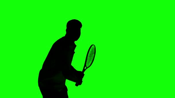 Silhouette eines Mannes beim Tennisspielen auf grünem Bildschirm — Stockvideo