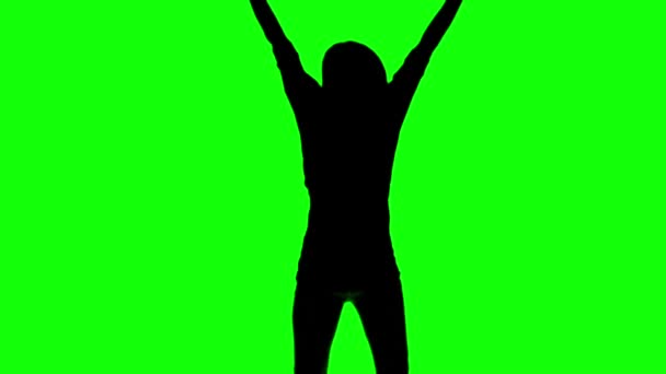 Silhouette of a woman jumping on green screen — Stock Video