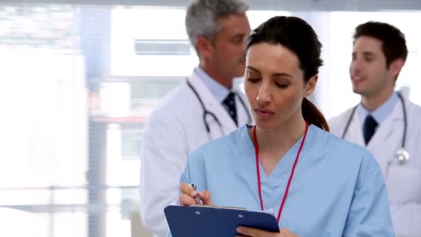 Tired nurse with clipboard — Stock Video