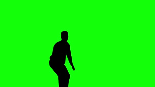 Silhouette eines Mannes springt mit erhobenen Beinen auf grünem Bildschirm — Stockvideo