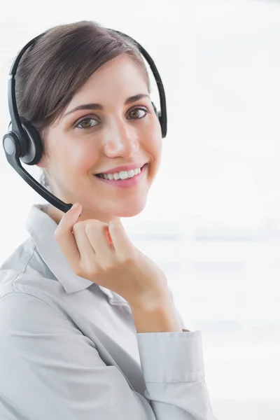 Call centre agent smiling at the camera — Stock Photo, Image