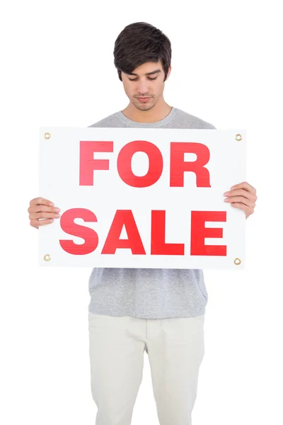 Man looking at a for sale board — Stock Photo, Image