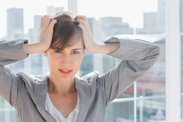 Frustrated businesswoman looking at camera — Stock Photo, Image