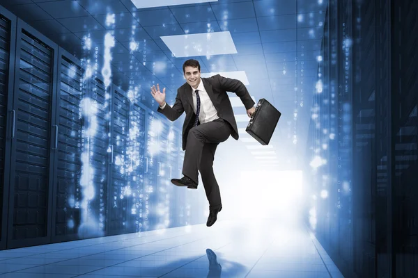 Businessman jumping in a corridor — Stock Photo, Image