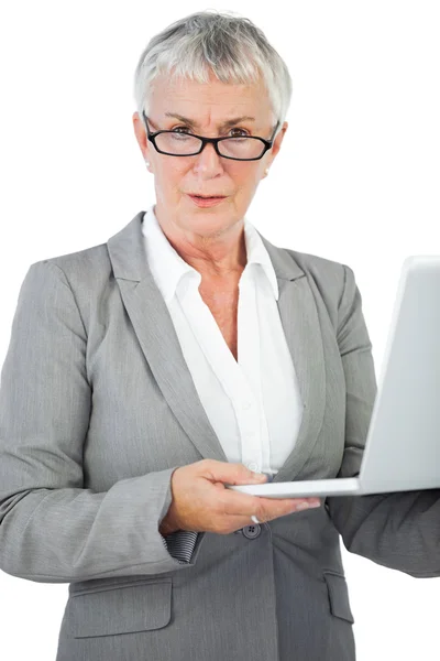 Businesswoman with glasses holding her laptop — Stock Photo, Image