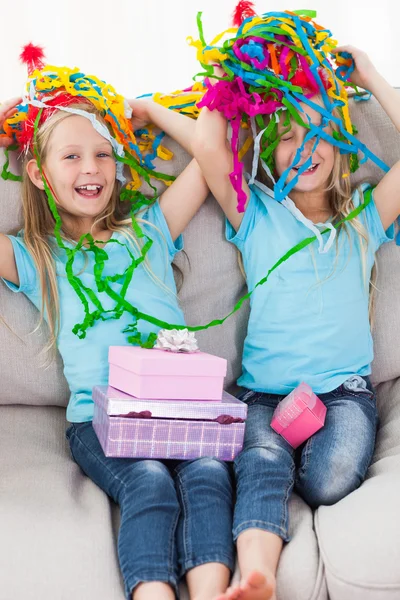 Twins playing with confetti during their birthday — Stock Photo, Image