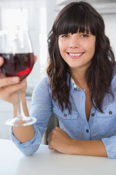 Attractive brunette having glass of red wine — Stock Photo, Image