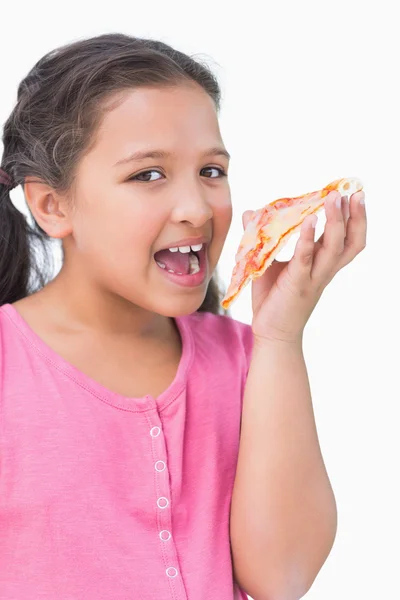 Smiling little girl eating pizza — Stock Photo, Image