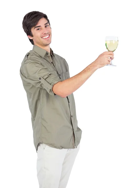 Happy young man with wine glass of white wine — Stock Photo, Image