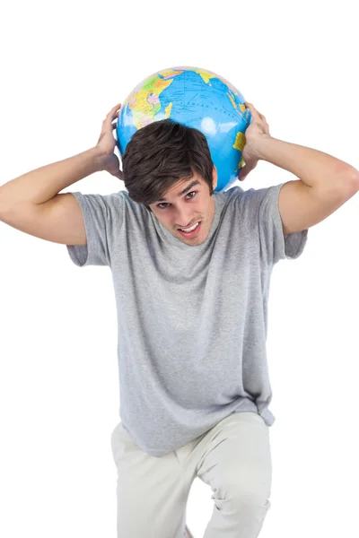 Man met een globe op zijn rug — Stockfoto