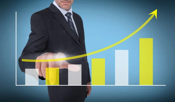 Businessman touching a growing chart — Stock Photo, Image