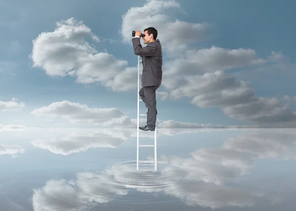 Elegant businessman standing on ladder with binoculars — Stock Photo, Image