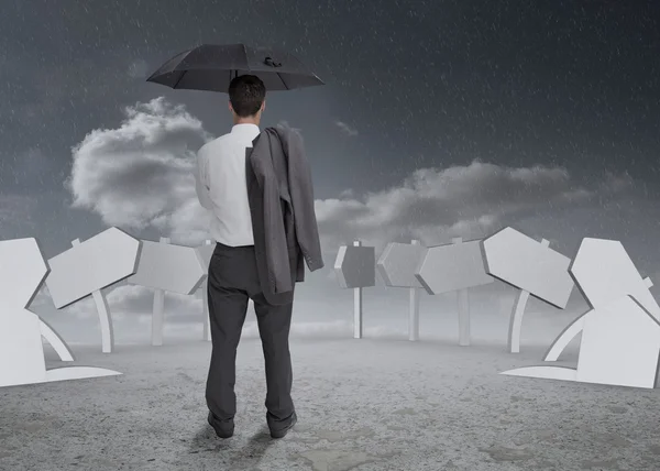 Thinking businessman holding his umbrella and jacket — Stock Photo, Image