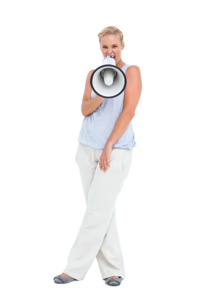 Blonde yelling through megaphone — Stock Photo, Image