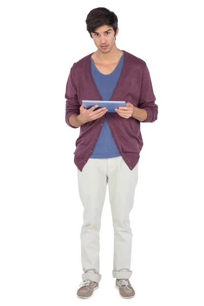 Young man with tablet pc looking at the camera — Stock Photo, Image