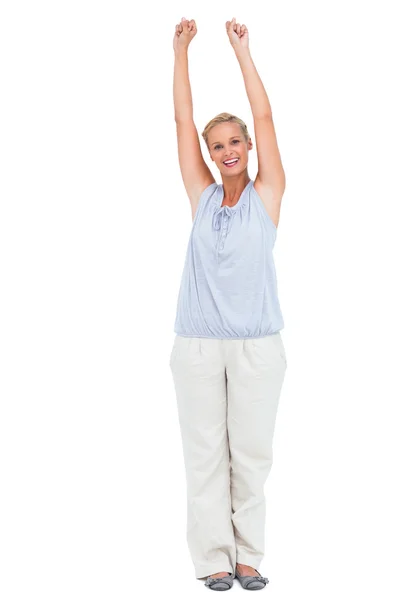 Excited woman standing with arms raised — Stock Photo, Image