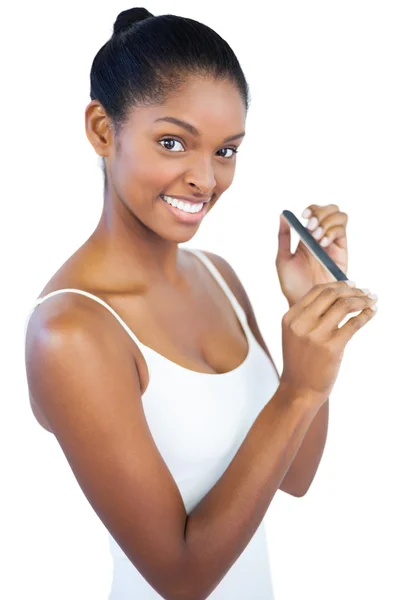 Woman using nail file — Stock Photo, Image