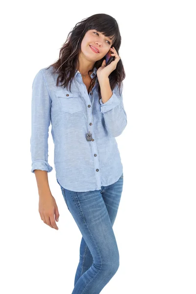 Happy brunette with her mobile phone calling someone — Stock Photo, Image