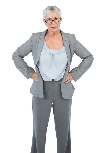 Serious businesswoman with her hands on hips — Stock Photo, Image