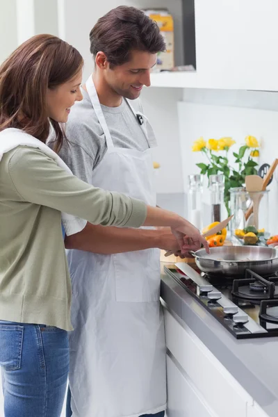 Delighted couple cooking — Stock Photo, Image