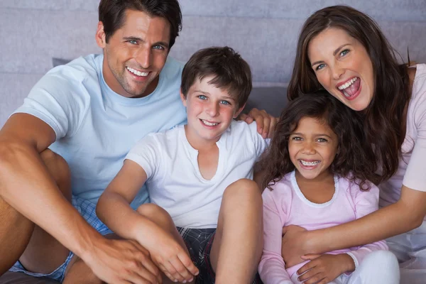 Parents and children smiling at camera — Stock Photo, Image