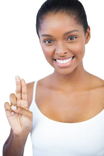 Woman showing moisturiser on her fingers — Stock Photo, Image
