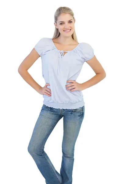 Blonde woman with hands on her hips — Stock Photo, Image