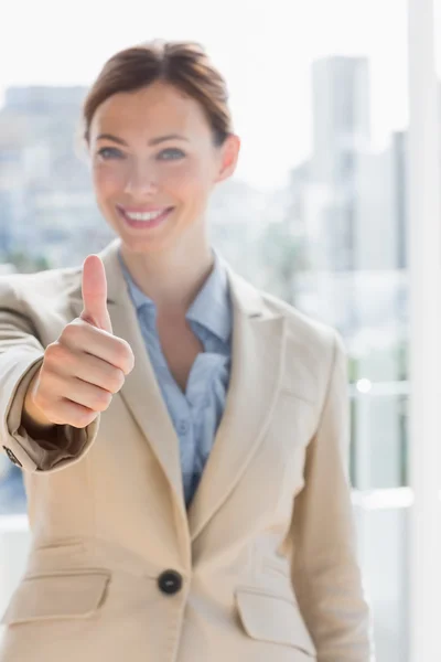 Pretty businesswoman giving thumb up — Stock Photo, Image