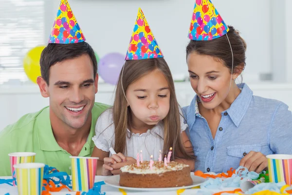 Little girl blowing out her candles — Stock Photo, Image