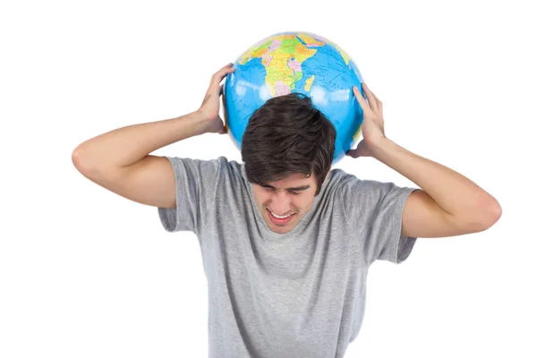 Man suffering because of a globe — Zdjęcie stockowe