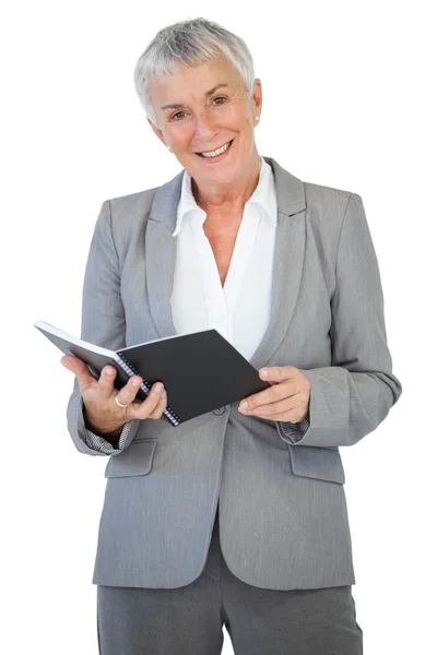 Happy businesswoman holding notepad — Stock Photo, Image