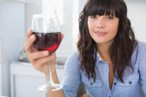 Pretty brunette having glass of red wine — Stock Photo, Image