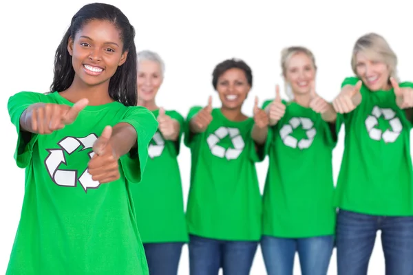 Team of female environmental activists smiling at camera and giv — Stock Photo, Image