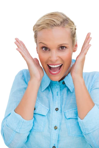 Surprised blonde woman looking at camera — Stock Photo, Image