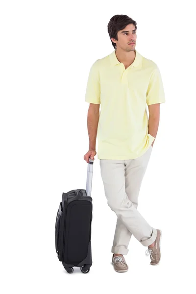 Serious man standing with his suitcase — Stock Photo, Image