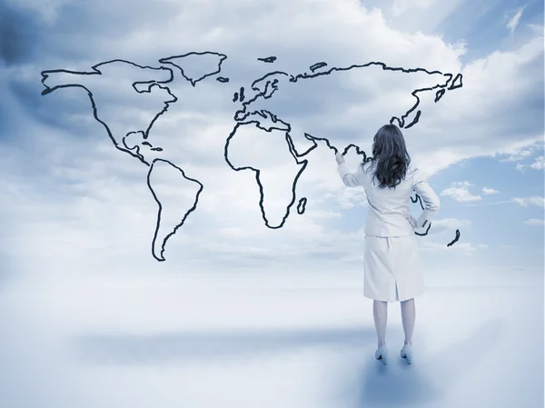 Businesswoman drawing a world map — Stock Photo, Image