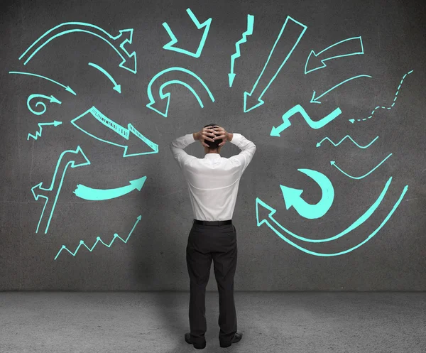 Anxious businessman looking at a wall — Stock Photo, Image