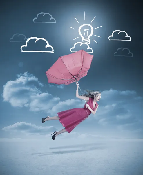 Glamour woman flying with a red umbrella — Stock Photo, Image