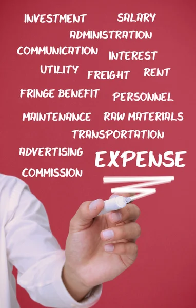 Businessman writing expense terms — Stock Photo, Image