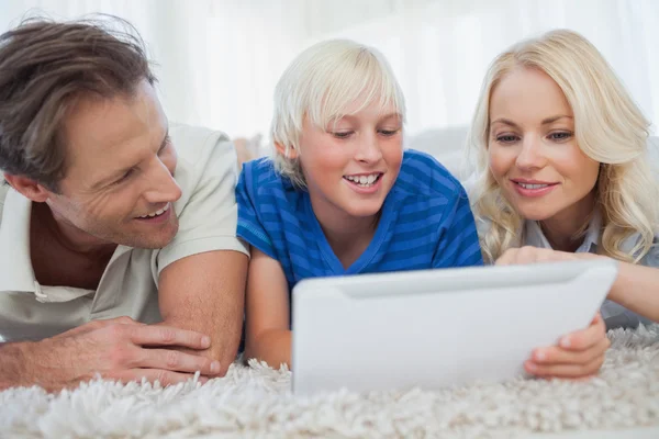 Son and his parents using a tablet — Stock Photo, Image