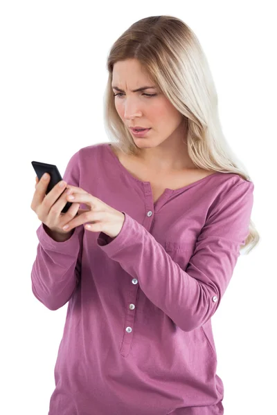 Worried woman sending text message — Stock Photo, Image