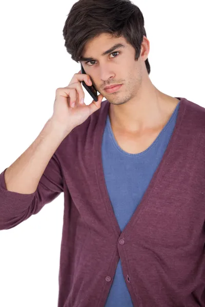 Upset young man with mobile phone — Stock Photo, Image