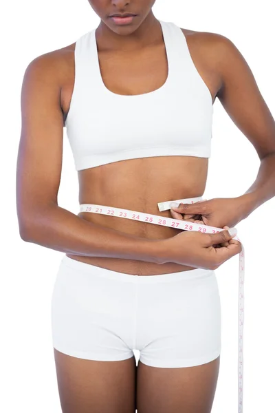 Young woman measuring her waist — Stock Photo, Image