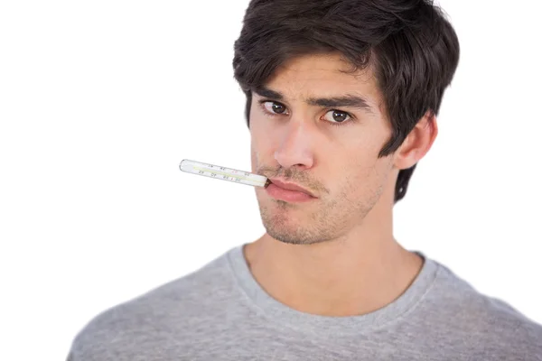 Man using a thermometer — Stock Photo, Image